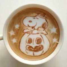 a coffee cup with a drawing of a pumpkin on it's cappuccino