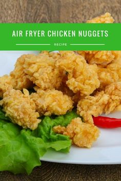 fried chicken nuggets on a white plate with lettuce and red peppers