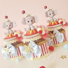 three circus themed cakes with elephants on top