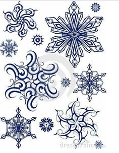 snowflakes and swirls in blue ink on white paper stock photo - image