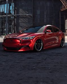 a red sports car parked in front of a building