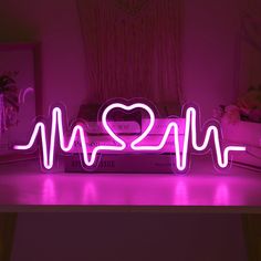 a neon sign that says i love you in the shape of a heart and heartbeat