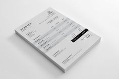 a white and black minimalistic business card on a plain surface with the words invoice printed on it