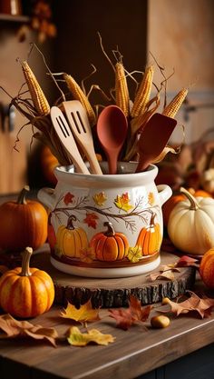 a white pot filled with lots of different types of utensils