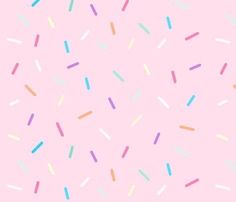 colorful sprinkles on a pink background