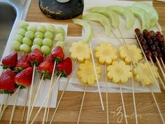 fruits and vegetables are arranged on skewers to look like they have been cut up