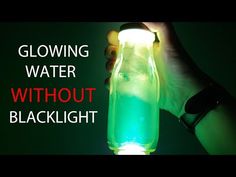 a person holding a glowing bottle with green liquid in it and the words glowing water without blacklight