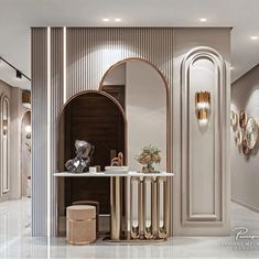 an elegant bathroom with gold accents and marble counter tops, along with mirrors on the wall