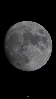 an airplane flying in front of the moon