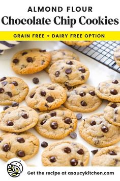 chocolate chip cookies on a cooling rack next to a towel and blue striped dish cloth