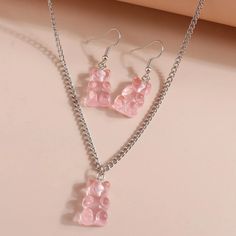 This Stunning Jewelry Set Is A Must-Have For Any Fashion-Forward Individual. The Set Includes A Beautiful Necklace And Matching Earrings, Both Featuring Adorable Light Pink Gummy Bears. (Not Edible-They Are Hard Plastic). The Silver Color Of This Set Perfectly Complements The Light Pink Bears, Making It A Versatile Accessory For Any Outfit. Add This Beautiful Set To Your Jewelry Collection Today! Pink Gummy Bears, Silver Pearl Jewelry, Earrings Necklace Set, Boho Chic Necklace, Colored Stone Rings, Lace Ring, Boho Crystal, Spike Earrings, Dainty Studs