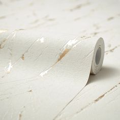 a roll of white paper sitting on top of a table