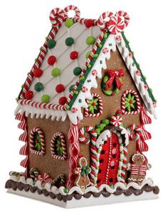 a gingerbread house is decorated with candy canes