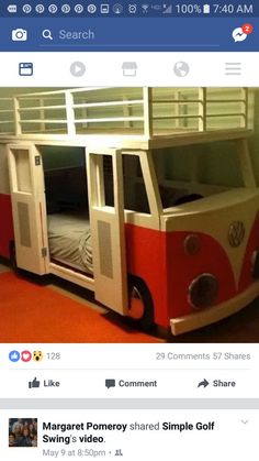 a red and white bunk bed sitting on top of a wooden floor