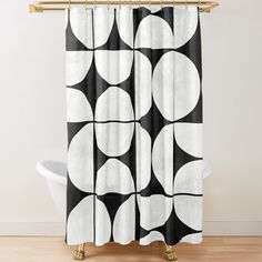 a black and white shower curtain with circles on it