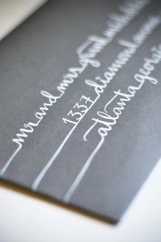 a close up of a wedding program with writing on the front and back of it