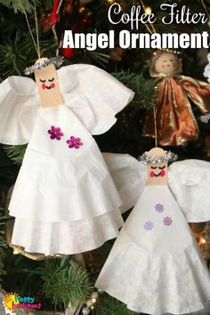 two angel ornaments hanging from a christmas tree with the words coffee filter angel ornaments on it