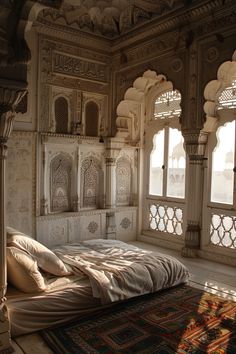 a bed sitting in the middle of a room with windows and rugs on the floor