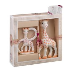 two toy giraffes in a box on a white background with pink trim