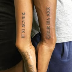 two people with matching tattoos on their arms