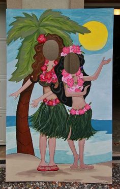 two women in hula skirts standing next to a palm tree