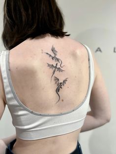 a woman with a tattoo on her back