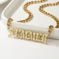 Introducing our Bold Textured Nameplate Necklace in Old English Font, an edgy twist on a classic style. Made from stainless steel, this necklace is not just about looks; it's waterproof, NON TARNISH, and tough enough to keep up with your everyday adventures.  Wear your name with pride and let this piece do the talking, whether you're dressing up or keeping it casual. DETAILS: -Materials: 18K Gold plated, 18K Rose Gold plated, or Stainless Steel. -Chain Lengths: 16 inches, 18 inches, 20 inches. - Gold Name Plate Necklace, Gold Name Plate, Nameplate Necklace Gold, Name Plate Necklace, Silver Name Necklace, Dope Jewelry Accessories, English Fonts, English Font, Old English Font