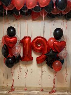 red and black balloons with the number 19 hanging from them