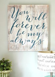 a wooden sign that says you will forever be my always on it next to a lamp