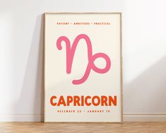 a poster with the zodiac sign capricorn on it in front of a white wall