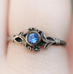 Such a CUTE flashy blue stone floral ring in sterling silver, would make a sweet engagement ring, or 'something blue'. Not a gemstone, but so perfectly sparkly.  Ring top 7 mm.  Has patina and shine.  Ring size: 6 3/4 US - have it resized by a jeweller near you, if you need to!  Please check out my other items too, I hope one of them has your name on it! RESERVE: I offer 3 day reserve, if you need a little bit more time to make a payment, but you do not want someone else snatching up an item you Vintage Birthstone Ring With Accent Stones As Gift, Engagement Rings Silver Blue, Vintage Promise Ring Jewelry With Accent Stones, Vintage Jewelry With Accent Stones For Promise Ring, Vintage Gemstone Flower Promise Ring, Vintage Crystal Birthstone Ring As Gift, Vintage Toe Ring For Promise, Vintage Topaz Promise Ring With Accent Stones, Vintage Topaz Ring With Accent Stones