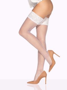 Perfection from top to toe, ISABELLA is the flagship model of the VienneMilano thigh high collection. Framed by a classic lace top that unfurls into a barely-there sheer, these are the thigh highs that will take you everywhere. Overtones of natural beauty and subtle sophistication are underpinned by luxury that will make any woman feel her best self. To bring out the best in your unique complexion, go Hazelnut for fair, Chestnut Brown for tan, and Chocolate Brown for dark! ISABELLA at a glance: Elegant Stretch Legwear For Formal Occasions, Elegant Formal Stretch Legwear, White Stretch Lace Hosiery, Lace Trim Hosiery, Sheer Fitted Lace Hosiery, Elegant Sheer High-cut Leg Stockings, Elegant Sheer High-cut Stockings, Elegant Stretch Stockings With Lace Trim, Elegant Stretch Lace Trim Hosiery