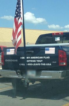 a truck with an american flag on the back