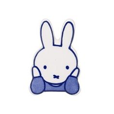 a blue and white rabbit with its head in the middle of it's ears