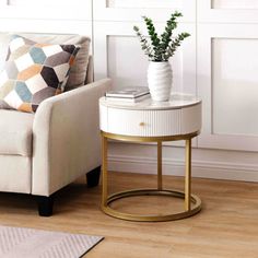 a living room with a chair, table and potted plant on the end table