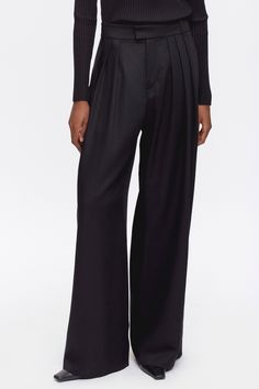 A breezy wide-leg trouser that exudes effortless elegance. Crafted from our drapey 100% lyocell twill, an ultra‑breathable renewable fibre derived from wood pulp. Designed with a flattering high waist and multiple pleats for added volume, and newly added belt loops for an adjustable fit and accessorizing. The Plaza Trouser is a statement pant that’s easily dressed up or down. Statement Pants, The Plaza, Effortless Elegance, Trouser Pants, High Waist, Wide Leg, Dress Up, Trousers, High Waisted