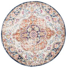 a round rug with an orange, blue and pink design on it's center