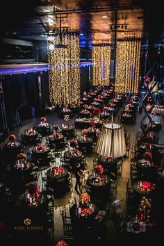 an overhead view of tables and chairs with lights on them