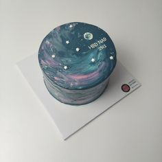 there is a cake with stars and the words out of this world on it's side