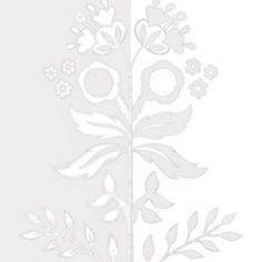 a white paper cutout with flowers and leaves