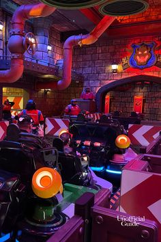 the interior of a restaurant with many tables and chairs, lights, and pipes on the walls