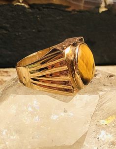 RESERVED 1920s Art Deco Tigers Eye 14kt Gold Vintage Ring Art Deco Jewelry Ring Size 7 1/2 over 1/2 wide and over 1/2 tall Weighs 8.7 grams Collectible Polished Yellow Gold Rings, Collectible Yellow Gold Rings With Polished Finish, Gold Heirloom Signet Ring With Cabochon, Heirloom Gold Signet Ring With Cabochon, Antique Yellow Gold Collectible Rings, Art Deco 14k Gold Hallmarked Rings, Art Deco 14k Gold Gemstone Jewelry, 14k Gold Art Deco Jewelry, Gold Cabochon Signet Ring Fine Jewelry