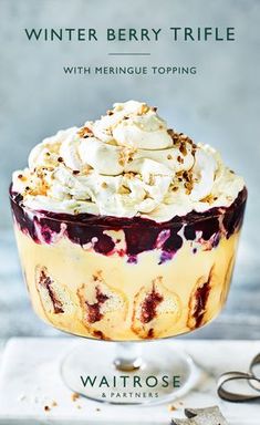 a dessert with meringue, madelie and winter berry trifle