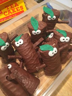 chocolate desserts in the shape of fruit with googly eyes and leaves on them