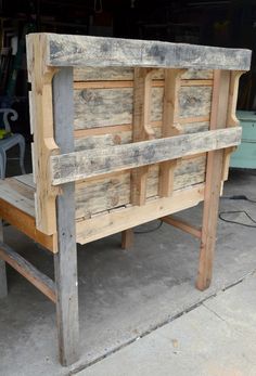 a wooden bench made out of pallet wood