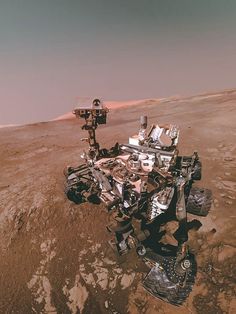 an image of a rover in the middle of the desert with no one around it