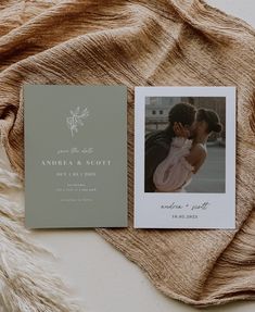 an open photo book with a couple's wedding photos on it next to a blanket