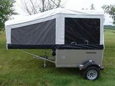 a trailer with a tent attached to it