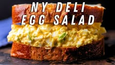 an egg salad sandwich with the words ny deli egg salad on it