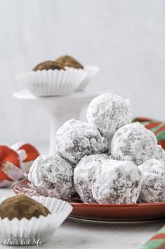 chocolate truffles on a plate with other desserts in the backgroud